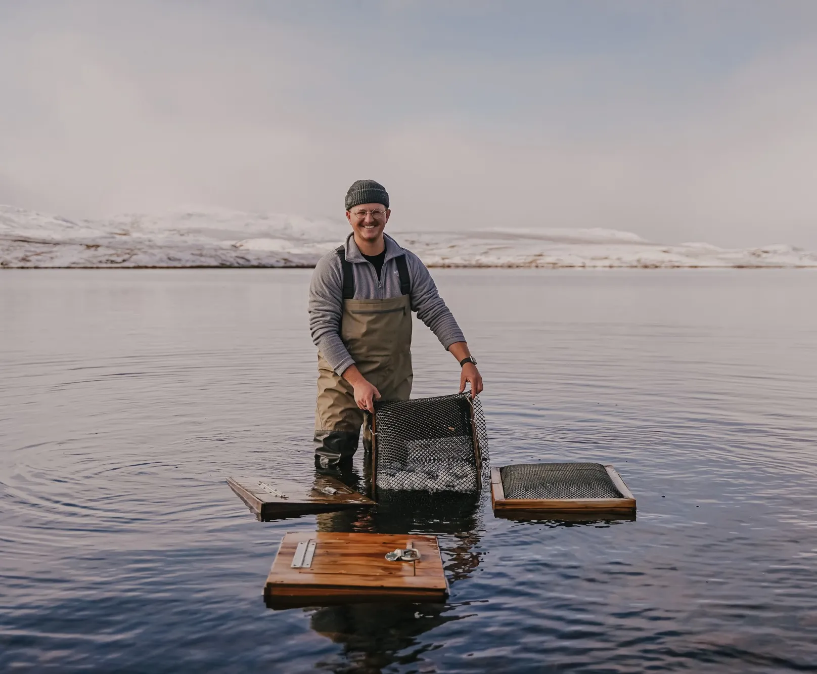 Undergraduate research student Jansen Nipko, from Brigham Young University, shows incubation boxes he made for an experiment, Credit: Jansen Nipko
